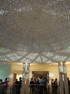 People experience an eclipse at the San Carlos Library rotunda.