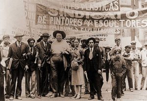 Mexican painters Diego Rivera and Frida Kahlo at May Day march in Mexico City, 1929. Photo by Tina Modotti.