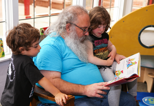 Family reading at the library.